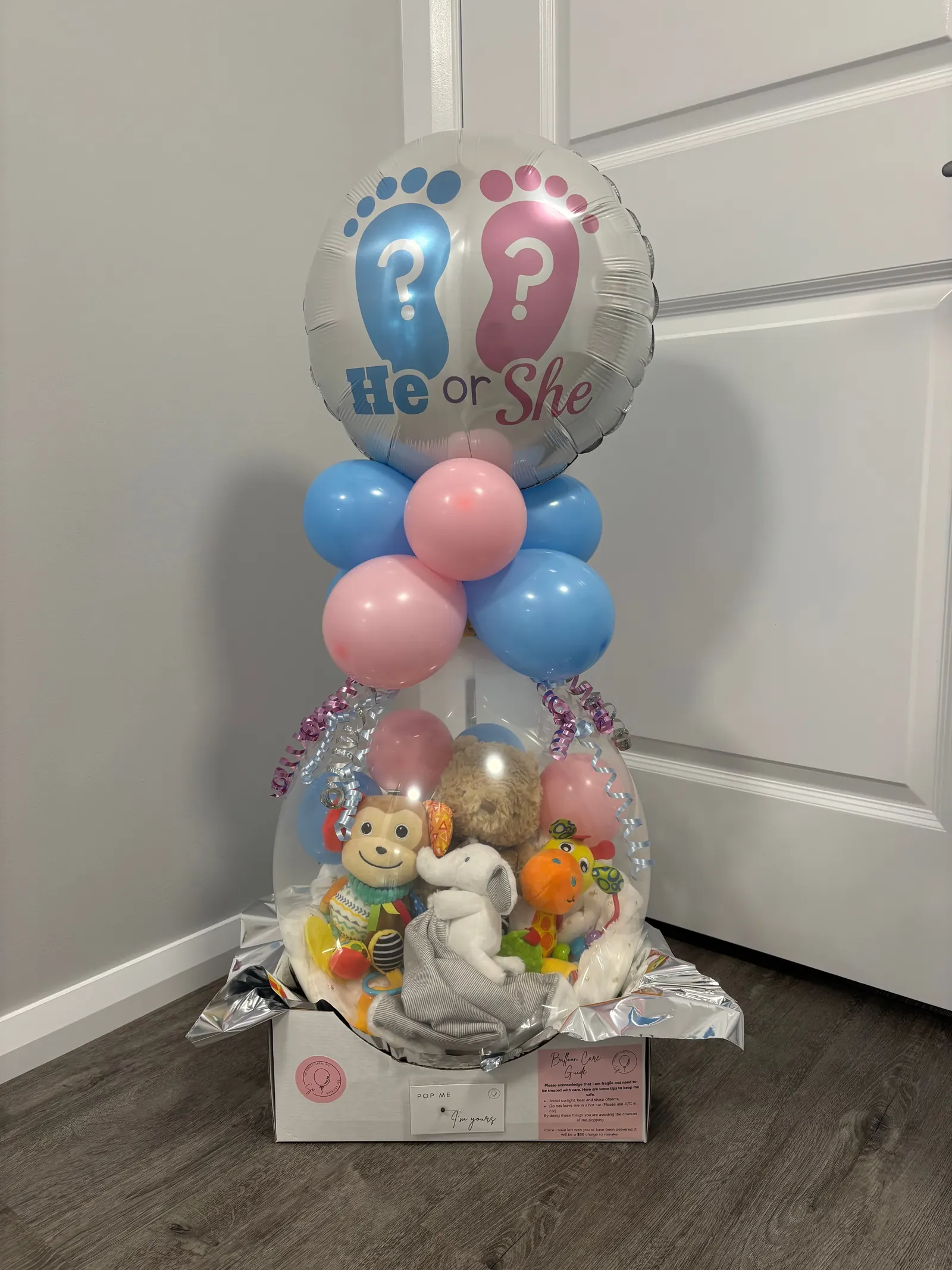 A hand-tied gender reveal balloon, as delivered
